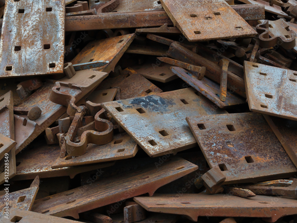 Pile of railroad t plates, spikes and clips for recycle Pile of railroad t plates, spikes and clips for recycle