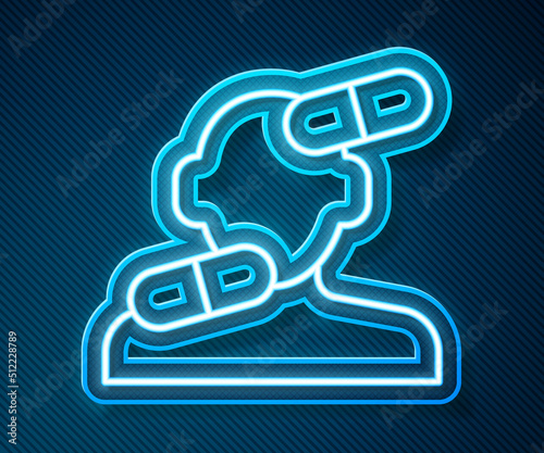 Glowing neon line Sedative pills icon isolated on blue background. Vector