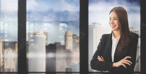 Elegant businesswoman standing in office. photo