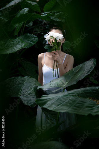 The girl in the green leaves photo