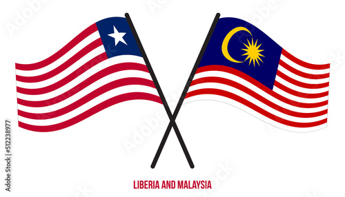 Liberia and Malaysia Flags Crossed And Waving Flat Style. Official Proportion. Correct Colors.
