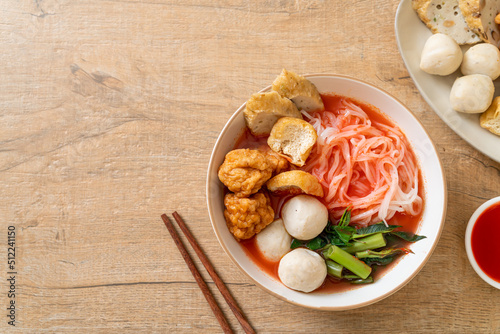 small flat rice noodles with fish balls and shrimp balls in pink soup, Yen Ta Four or Yen Ta Fo