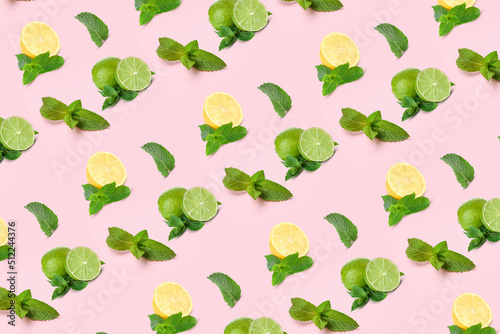 Many mint leaves, limes and lemons on pink background. Pattern for design