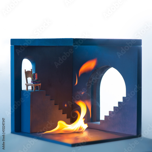 Fire in a room with steps and a chair, anxiety concept. This IsFine meme photo