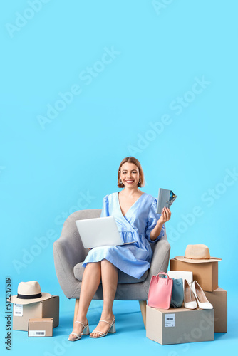 Young woman with laptop, wa...
