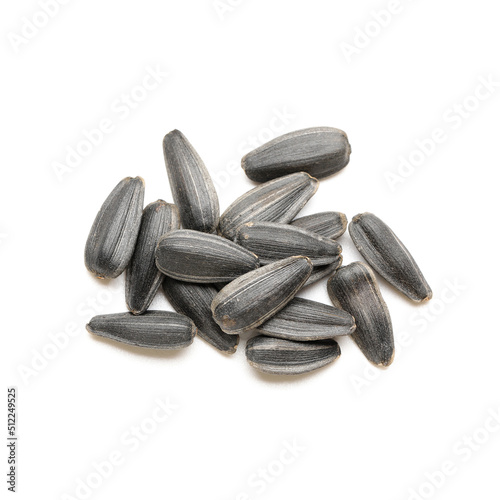 Heap of unpeeled sunflower seeds on white background