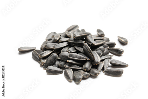 Pile of unpeeled sunflower seeds on white background