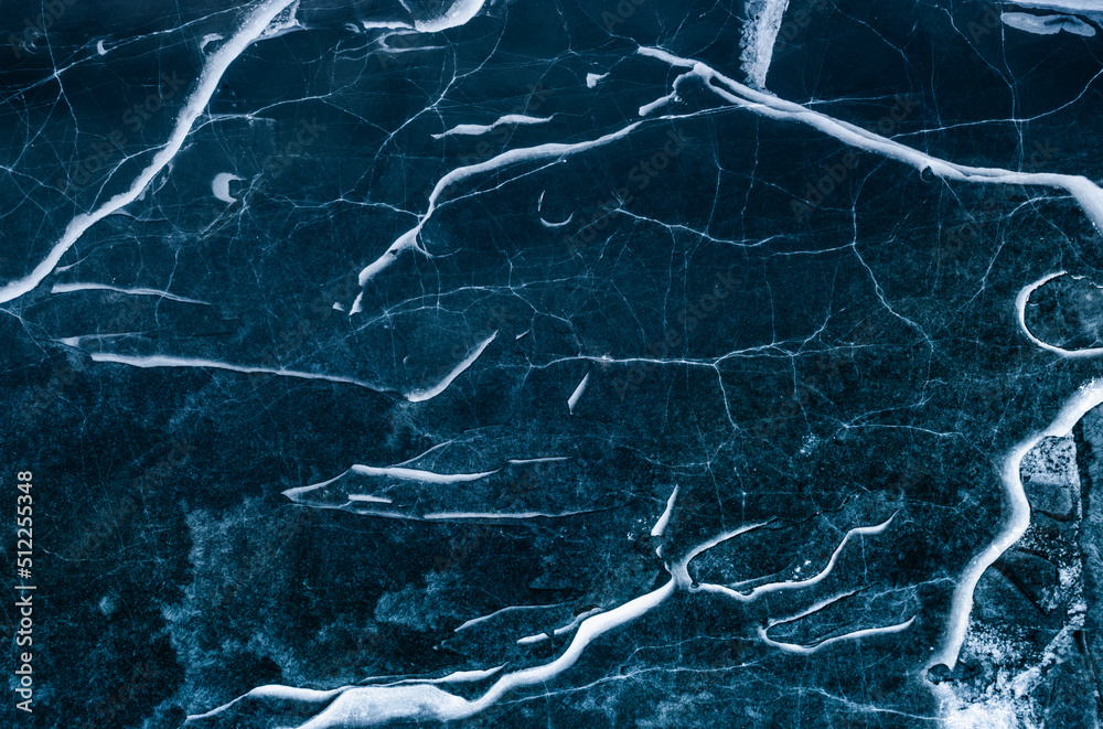 Aerial shot of ice cracks in Juriver lake in winter Aerial shot of ice cracks in Juriver lake in winter