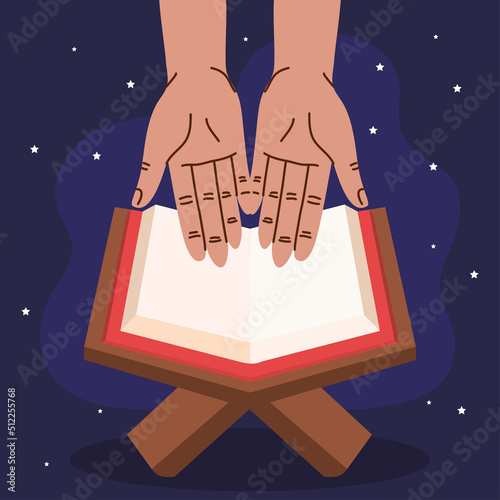 hands praying with koran