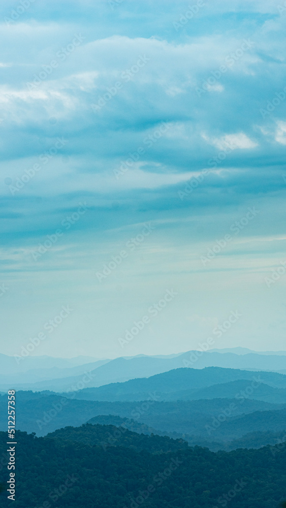 A picture of Western Ghats of India  taken in an early morning.The Western Ghats or the Western Mountain range is a mountain range that covers an area of 160,000 km2 in a stretch of 1,600 km parallel 