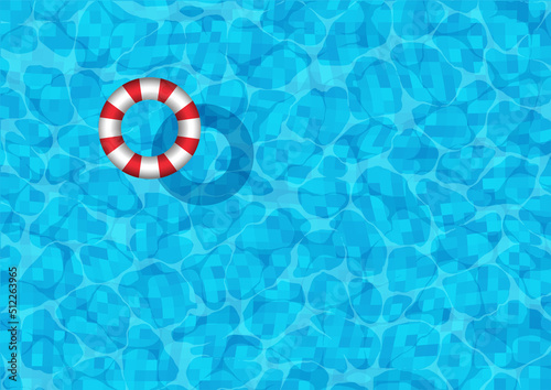 Swimming pool background with striped rubber ring floating on the surface