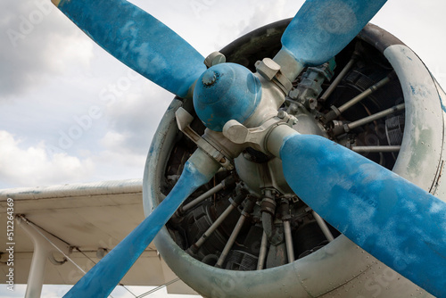 Vintage airplane with blue propeller