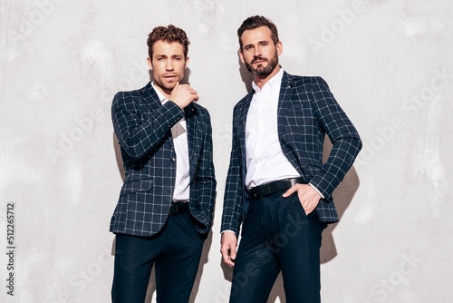 Fototapeta Portrait of two handsome confident stylish hipster lambersexual models
