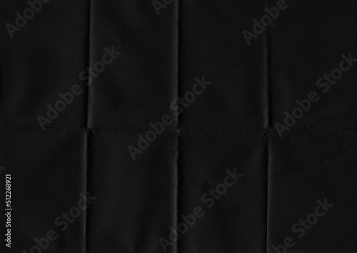 Folded paper texture. Folded black paper texture background. High resolution texture. Folded black paper.
