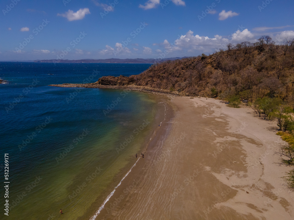 Beautiful aerial view of Costa Rica Beach Playa Rajada in Cuajiniquil Guanacaste in magical yellow sunset