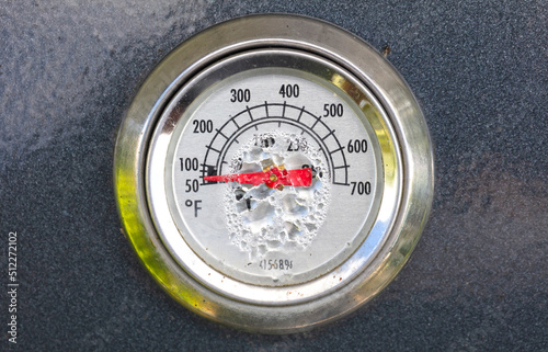 Old BBQ thermometer with water damage