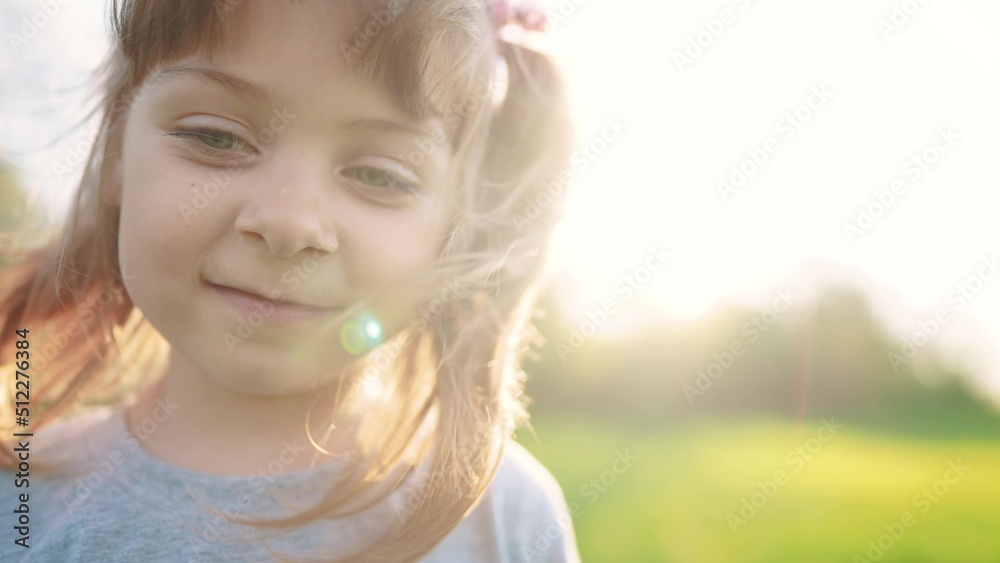 people in the park. sun portrait little girl outdoors. happy family kid dream concept. child a girl kid portrait close-up in the park glare. happy cute baby in summer outdoors flare close up portrait people in the park. sun portrait little girl outdoors. happy family kid dream concept. child a girl kid portrait close-up in the park glare. happy cute baby in summer outdoors flare close up portrait