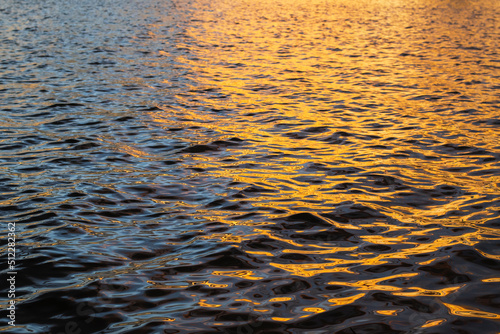 the evening sun water is quiet and beautiful