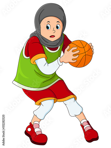 The hijab girl is playing basketball and holding the ball