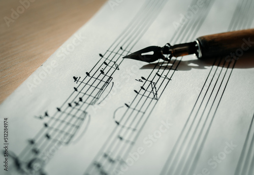 Music sheet, sheet music and feather, concept of composing music, music background