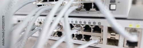 Set of cable network connected to internet switch servers in center photo