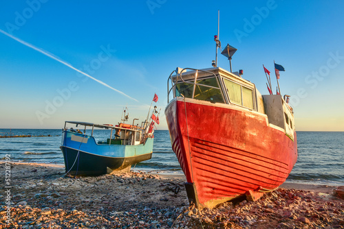 colorful fishing boats in the first rays of sun, the Baltic Sea in Poland