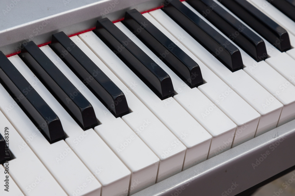 close-up of piano keys. close frontal view, black and white piano keys, viewed from above close-up of piano keys. close frontal view, black and white piano keys, viewed from above