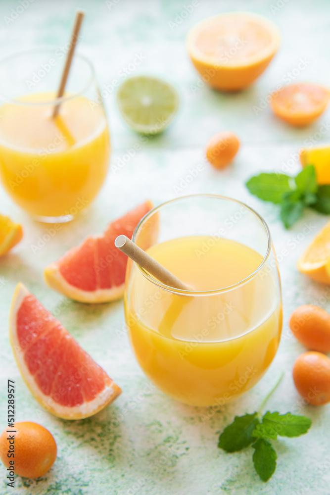 Glass of juice and citrus fruits Glass of juice and citrus fruits