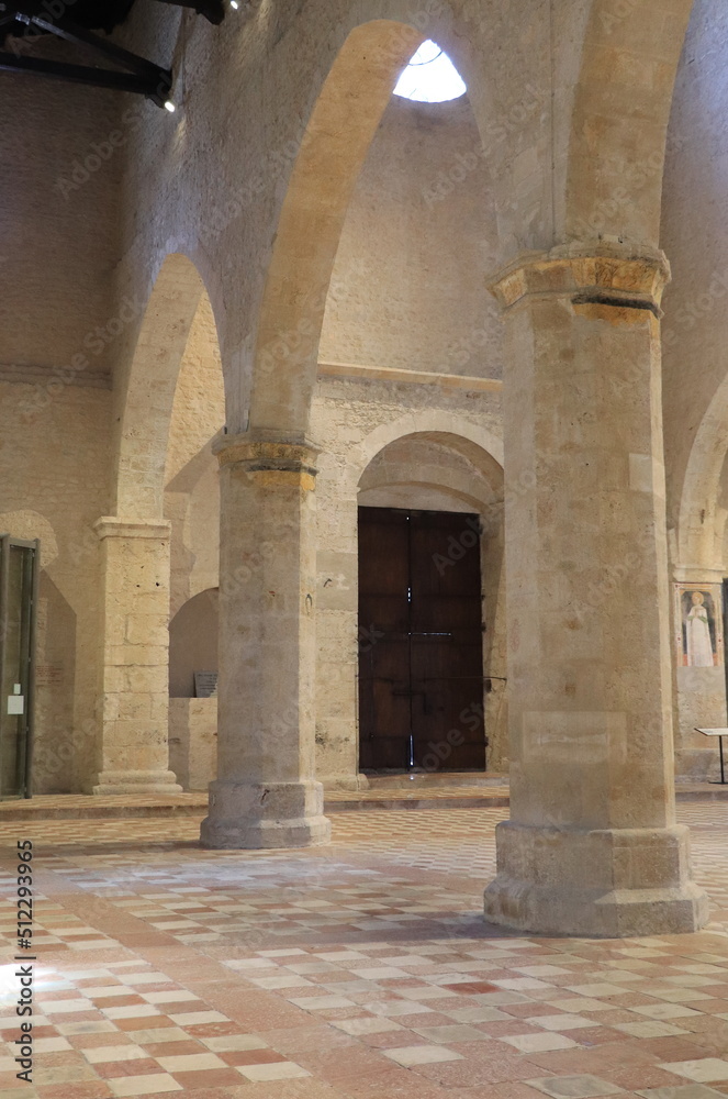 Santa Maria di Collemaggio Basilica Interior Detail with Floor, Columns and Wooden Door in L'Aquila, Abruzzo, Italy