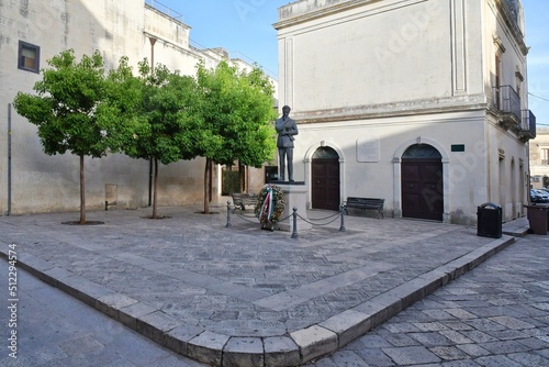 A small square in the historic district of Maglie, a village in the Puglia region of Italy.	 photo