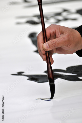 A Calligrapher hand writing chinese calligraphy