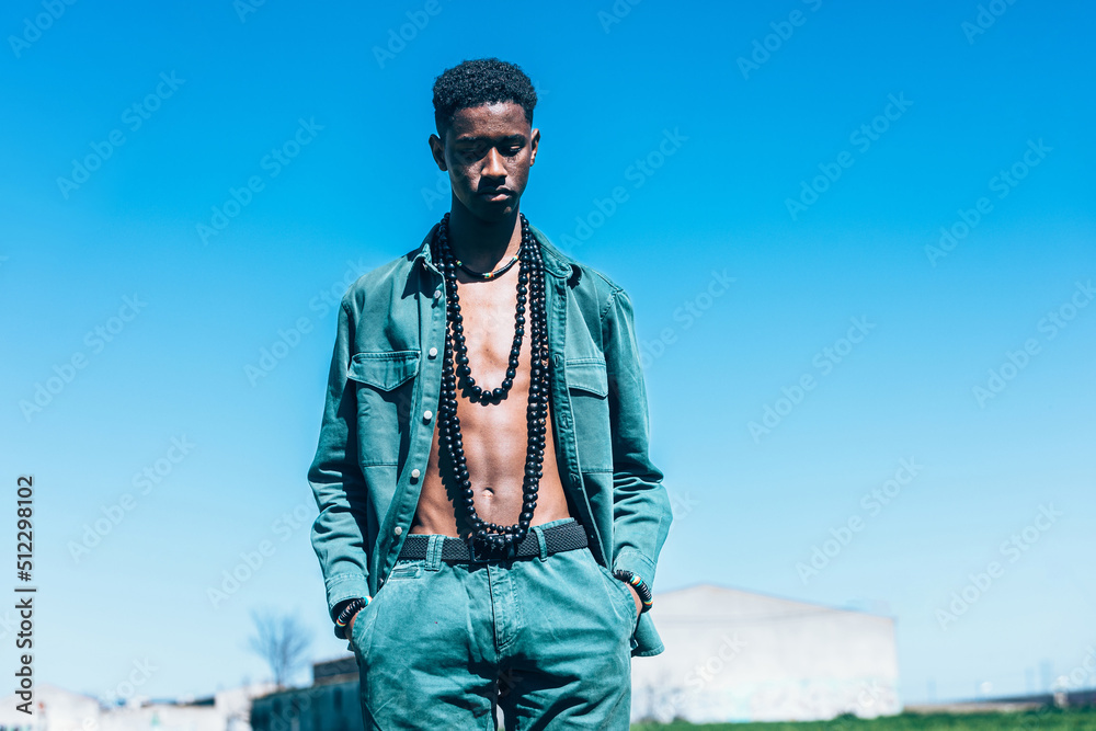 African man in denim clothes in countryside African man in denim clothes in countryside