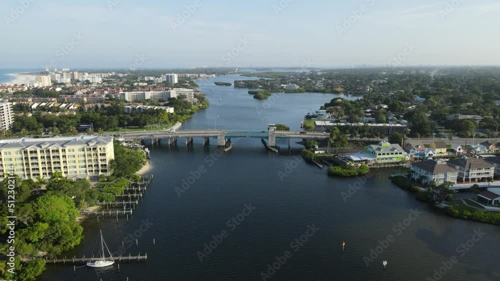 Camera is flying towards a small drawbridge at Siesta Key, Florida. The intercostal water way sits between the main land and the island. Camera is flying towards a small drawbridge at Siesta Key, Florida. The intercostal water way sits between the main land and the island.