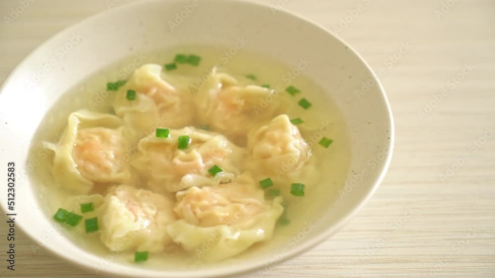 shrimp dumpling soup in white bowl - Asian food style shrimp dumpling soup in white bowl - Asian food style