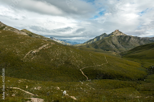 Hiking trail between the mountains in the Witfontein nature reserve with mountain at the back.