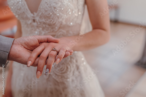 Fotobehang bride and groom holding hands