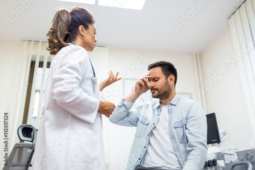 Patient receiving bad news, he is desperate and sad, Doctor support and comforting patient with sympathy. Don't worry, this medical test is not so bad