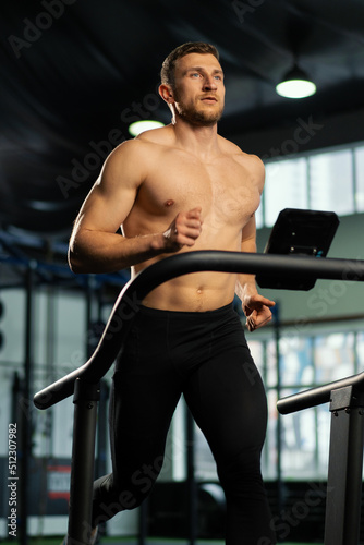 Male athlete running on a treadmill