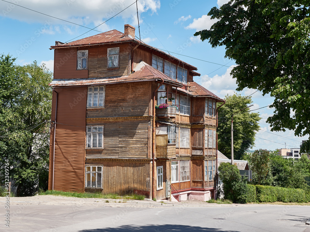 Old multi-storey wooden house on the outskirts of the city. Old multi-storey wooden house on the outskirts of the city.