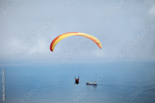 paraglider in the sky over the sea