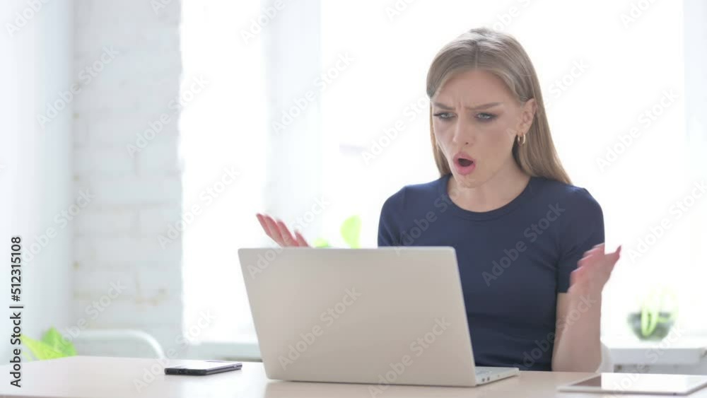 Woman Reacting to Loss While using Laptop Woman Reacting to Loss While using Laptop