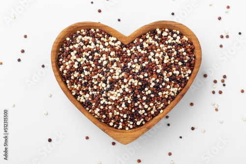  Quinoa in heart wooden bowl on white background