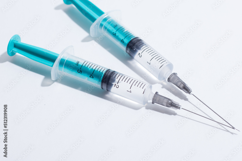 Disposable plastic syringe prepared for injection and vaccination in the hospital. The concept of medicine and health Disposable plastic syringe prepared for injection and vaccination in the hospital. The concept of medicine and health
