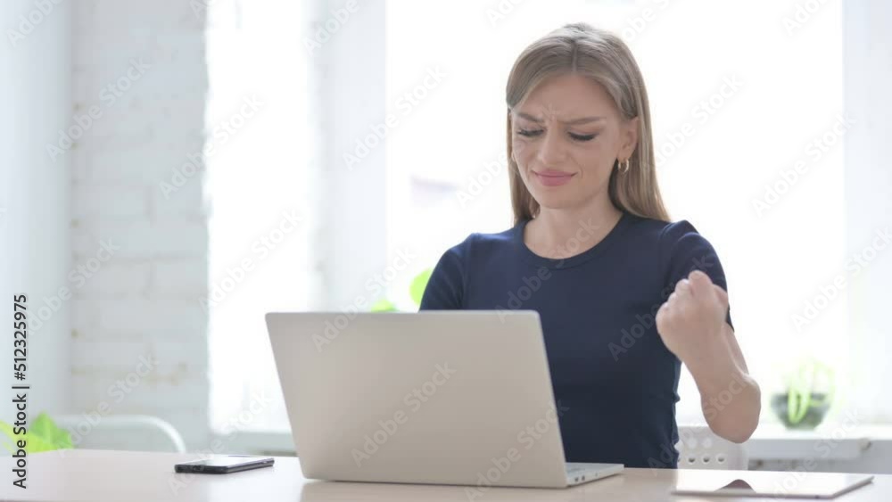 Woman having Wrist Pain while using Laptop Woman having Wrist Pain while using Laptop