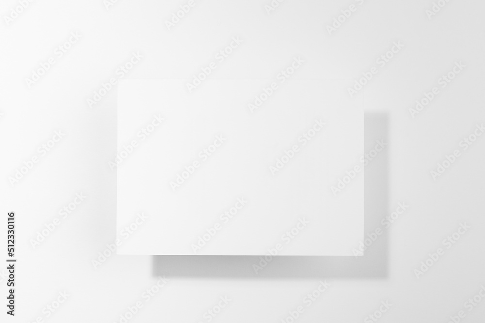 White blank card for text mockup in hard light with shadows soar on soft light white background. Simple modern template for advertising, branding identity, greeting card, poster, design, flyer. White blank card for text mockup in hard light with shadows soar on soft light white background. Simple modern template for advertising, branding identity, greeting card, poster, design, flyer.