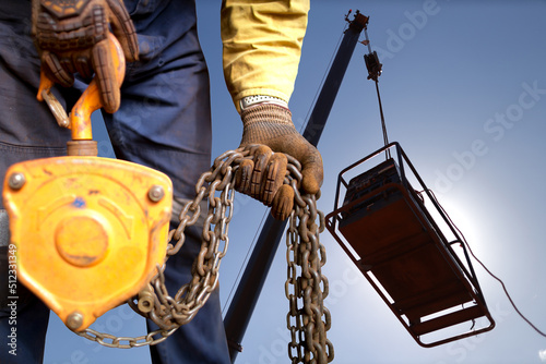 Photo Safety workplace close up image of trained competent rigger high risk worker wea