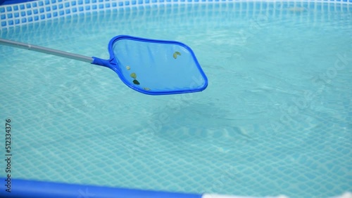 Cleaning the surface of a home pool with a skimmer