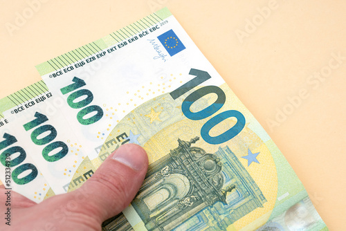 Person holding 300 euro money photo