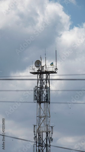 Communication tower with the flag of Ukraine