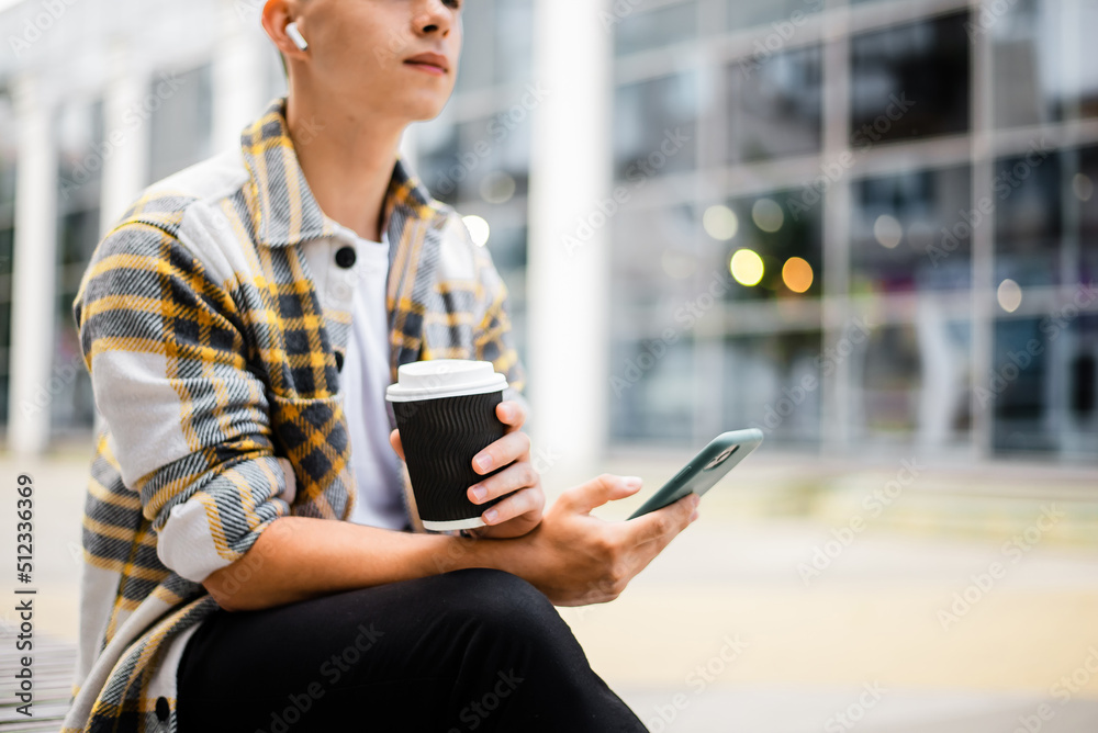 drinks, technology and people concept - close man with coffee cup and smartphone outdoors drinks, technology and people concept - close man with coffee cup and smartphone outdoors